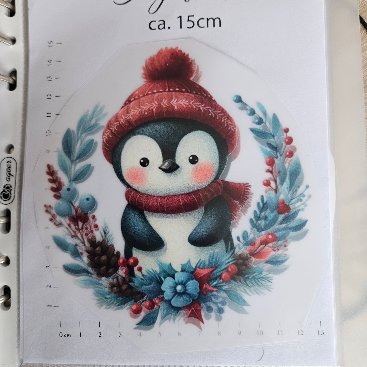 Bügelbild - ca. 15cm - Pinguin im Blumenkranz