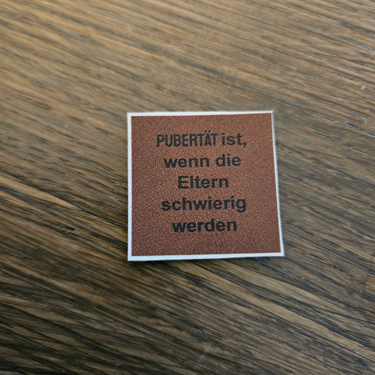 Kunstlederlabel - Pubertät ist... Braun